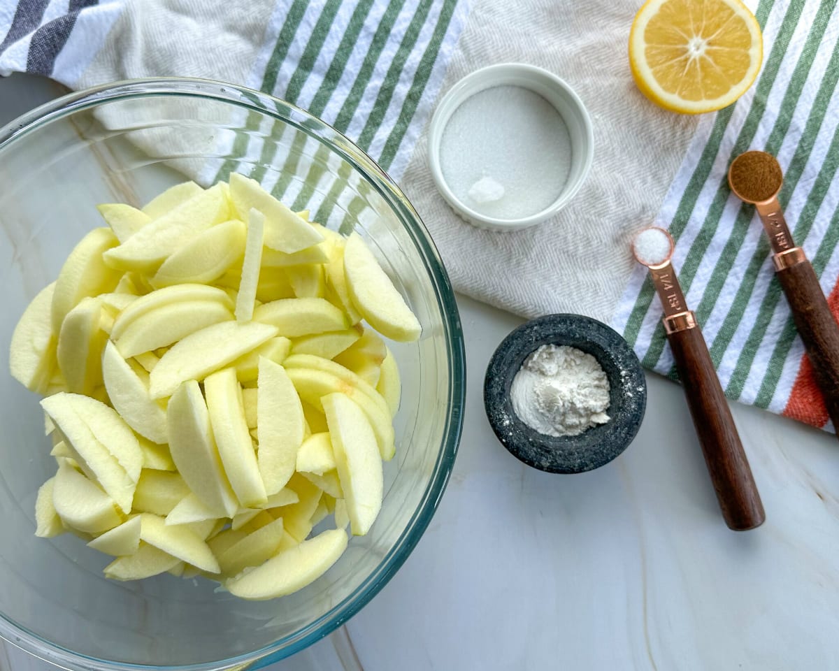 Peeled and sliced apples ready to combine with ingredients for a crumble fruit filling