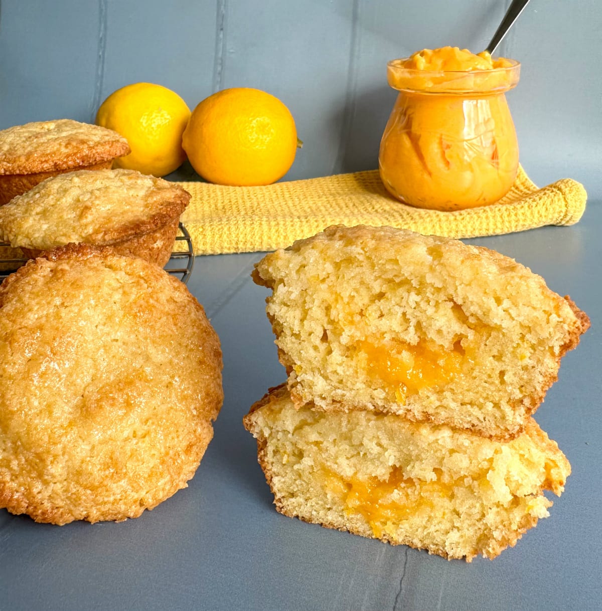 Lemon muffins on a blue  background with lemon curd filling 