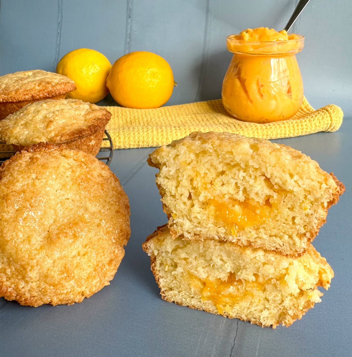 Lemon muffins on a blue background with lemon curd filling 