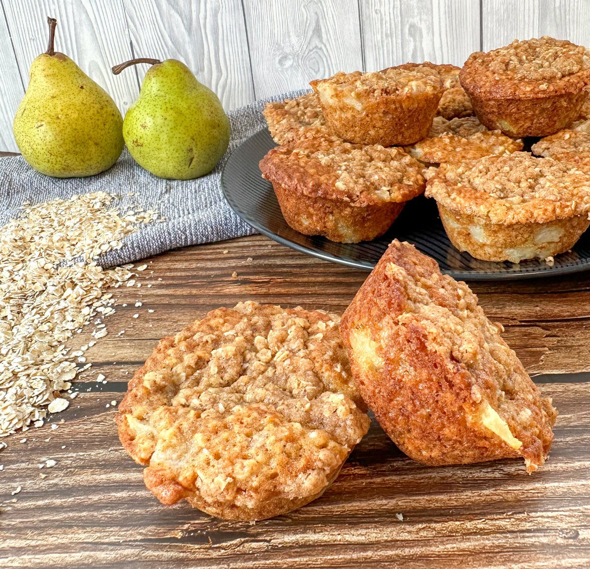 Pear and Oatmeal cookies on a black plate, showing chunks of pear