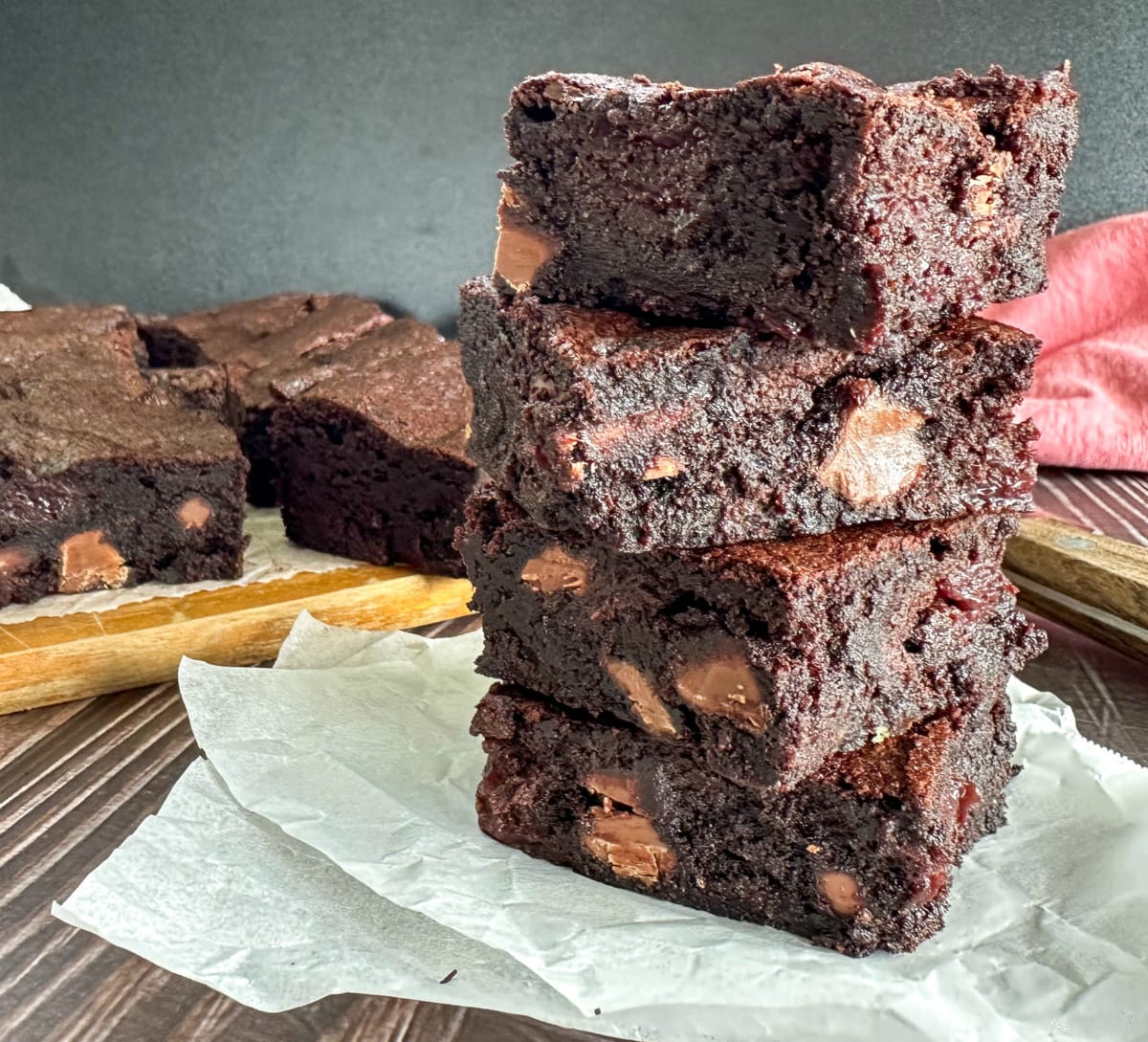 Stack of Cherry Chocolate Brownies with chunks of chocolate and cherries 