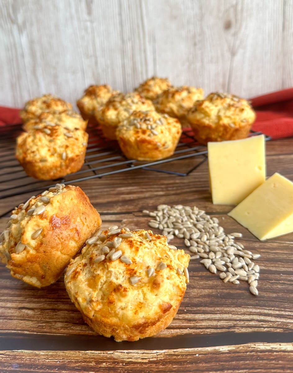Cheese and sunflower seed muffins on a cooling wire rack