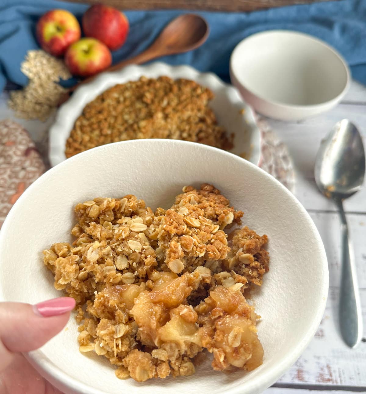 Apple Anzac Crumble served in a white bowl