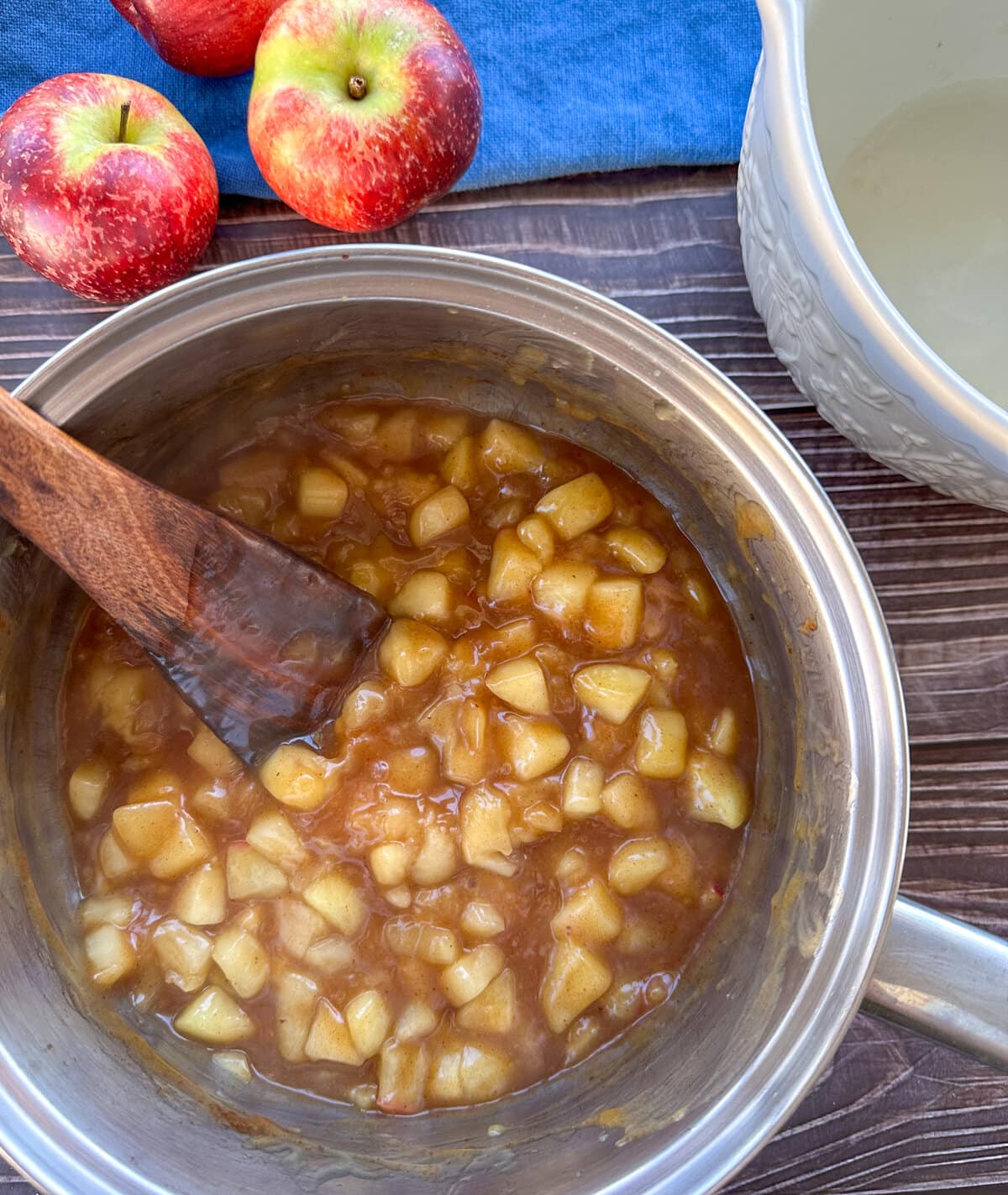 Saucepan with warm apple pie filling