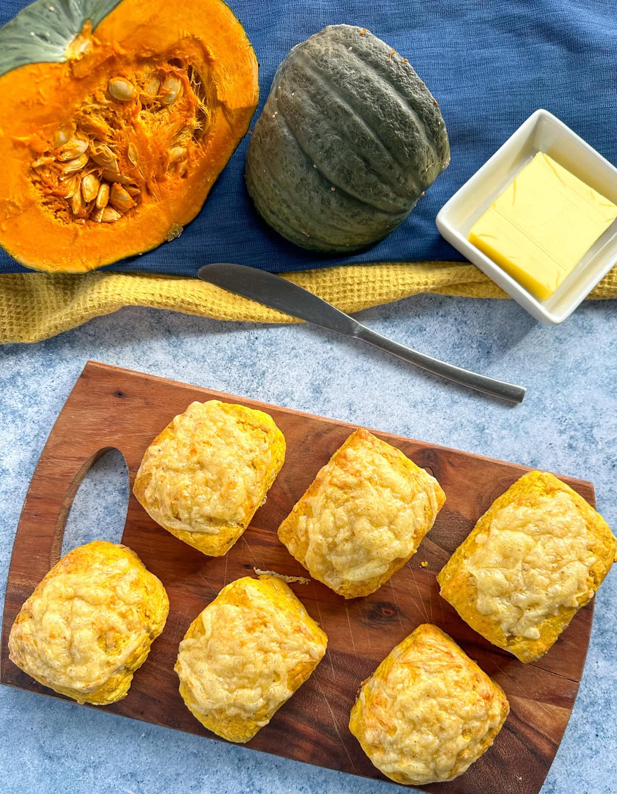 Pumpkin and cheese scones on a wooden board