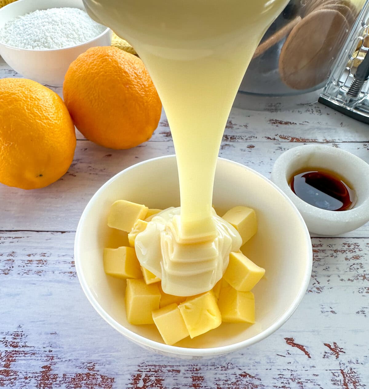 Condensed milk pouring into butter for a truffle recipe