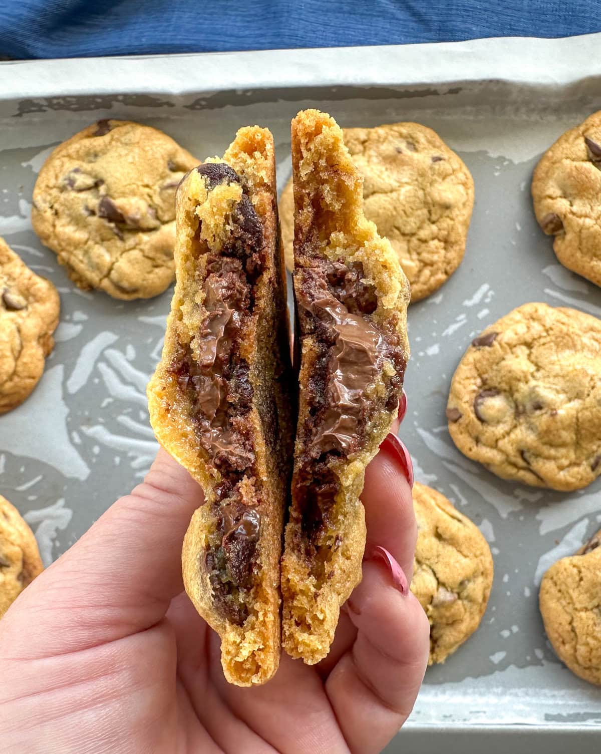 Showing the center of a gooey Nutella stuffed cookie