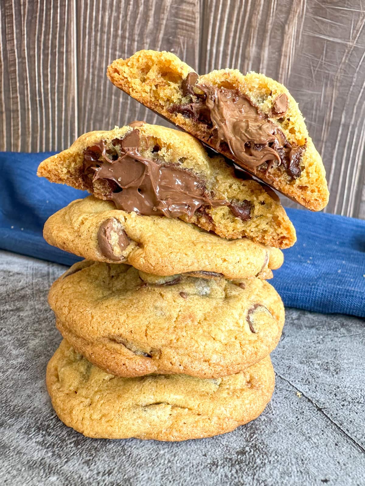 A pile of cookies showing Nutella oozing out of the centre