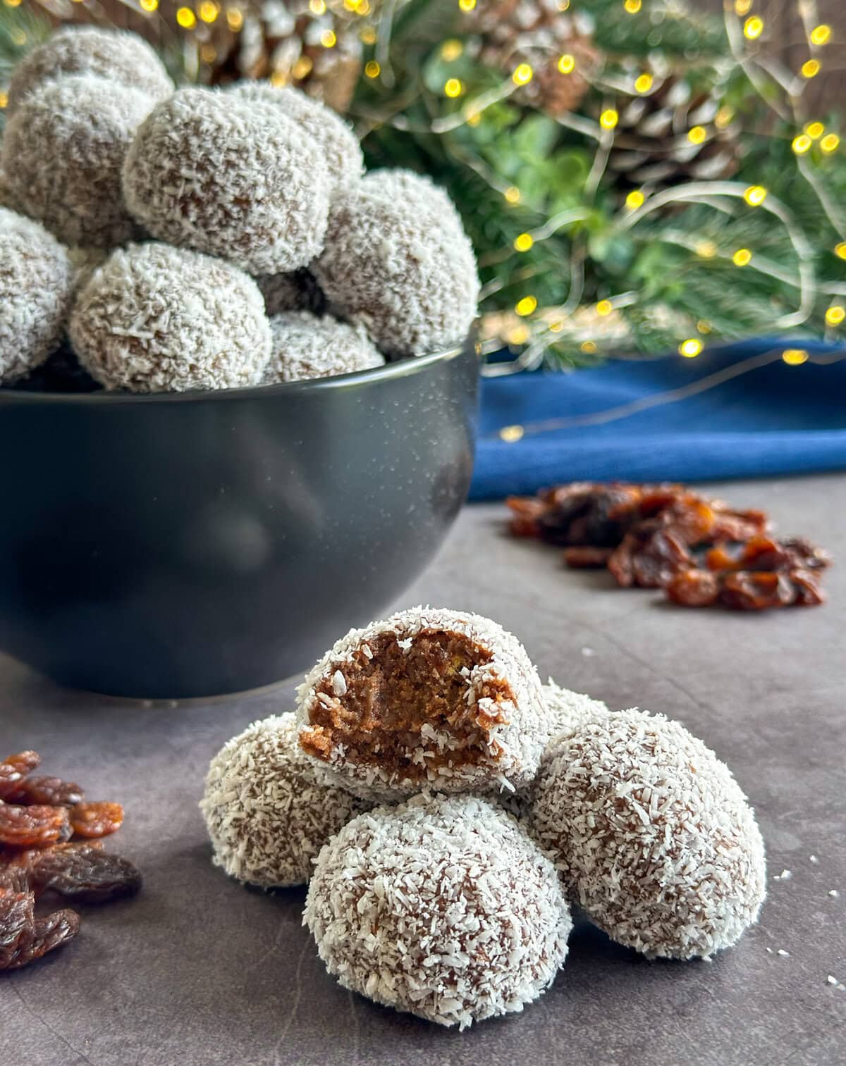 Rum and Raisin truffle with a bite taken out to show the inside of the ball