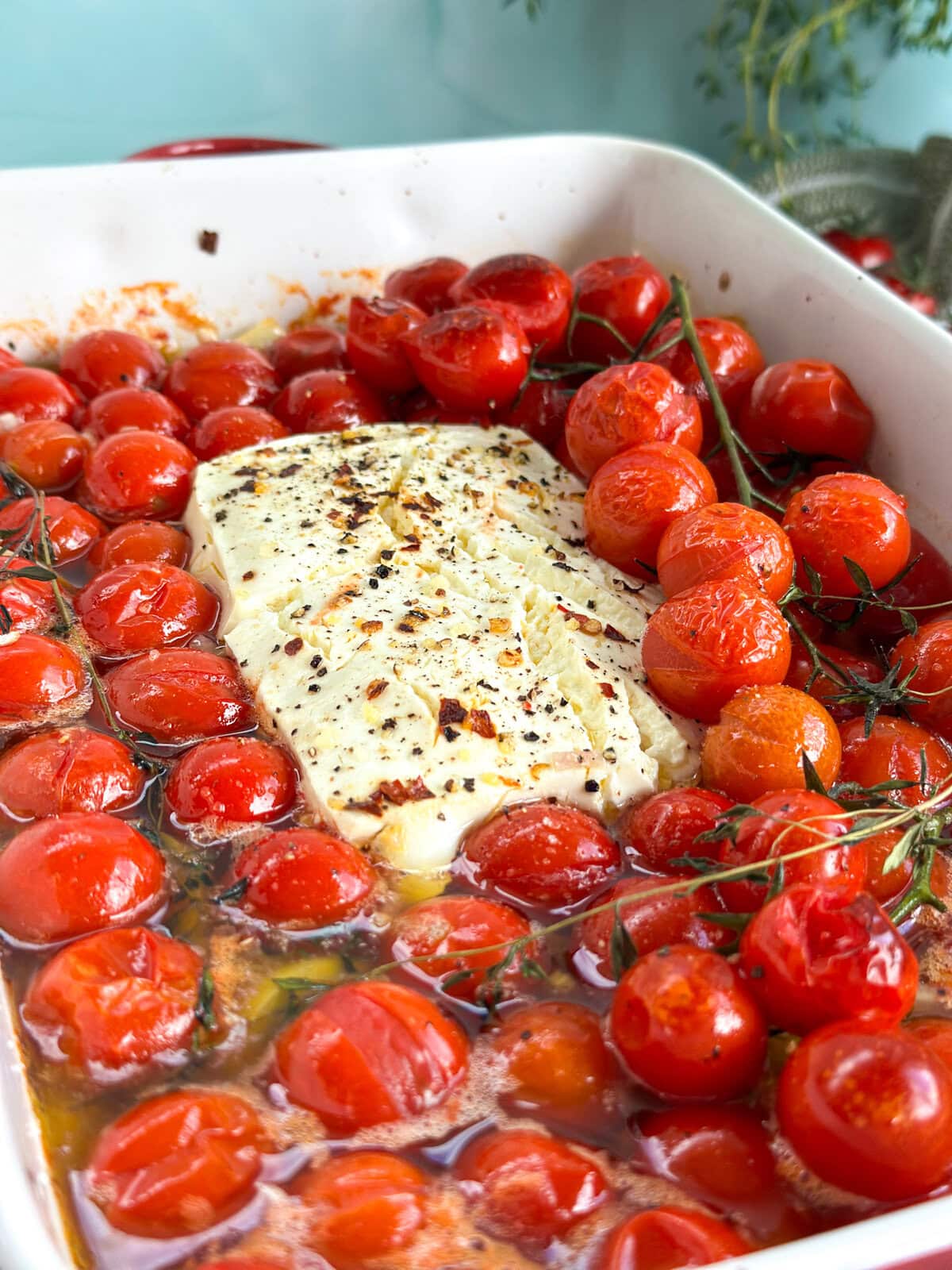 Cherry tomatoes baked in olive oil part way through roasting