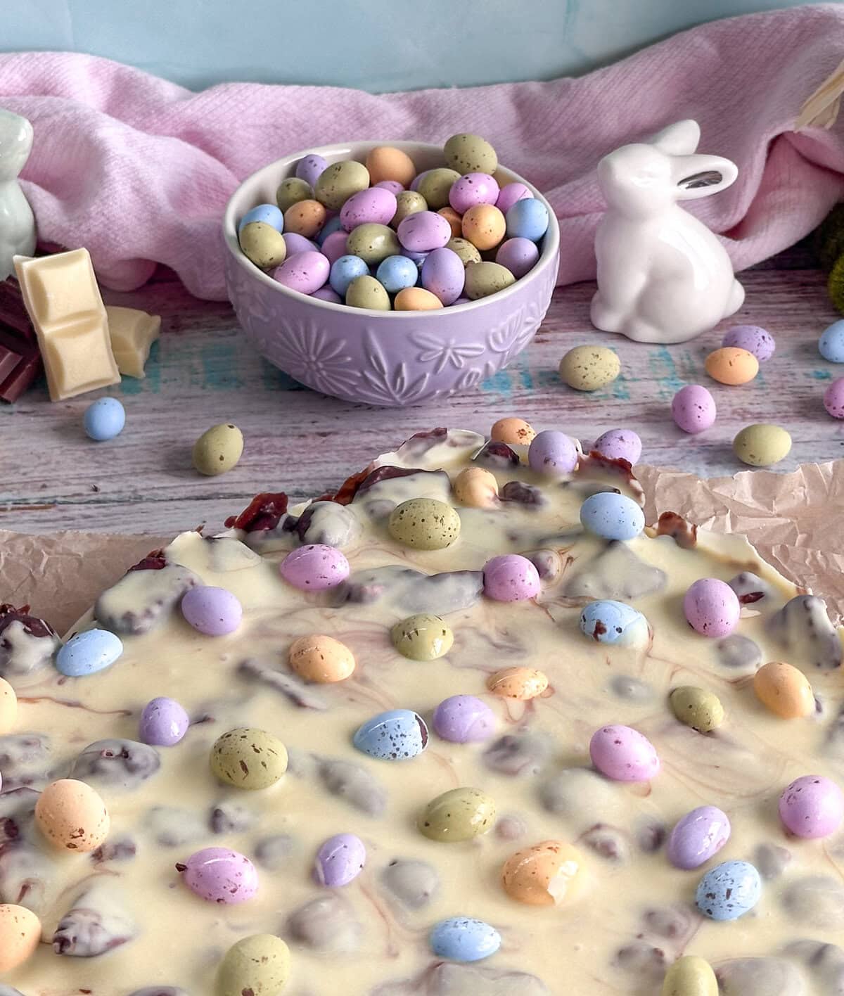 Slab of Easter rocky road, milk and dark chocolate base with a white chocolate topping and Easter eggs