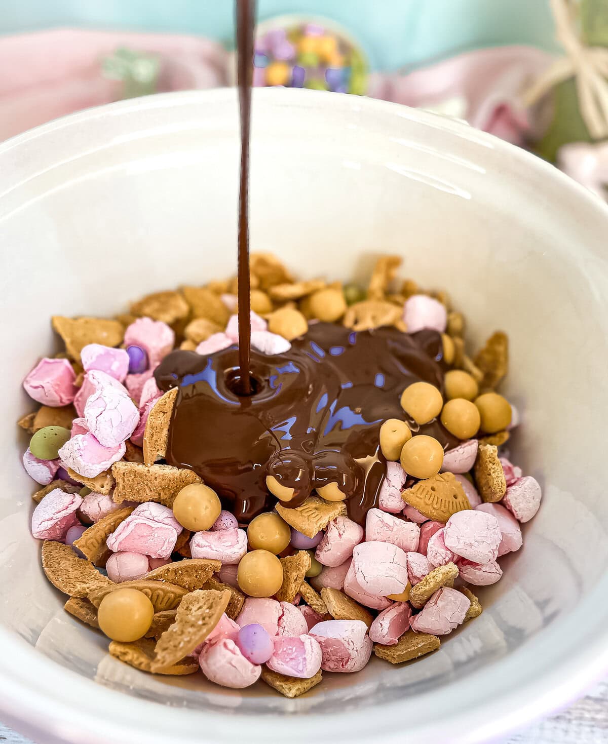 Pouring melted chocolate into the rocky road mix