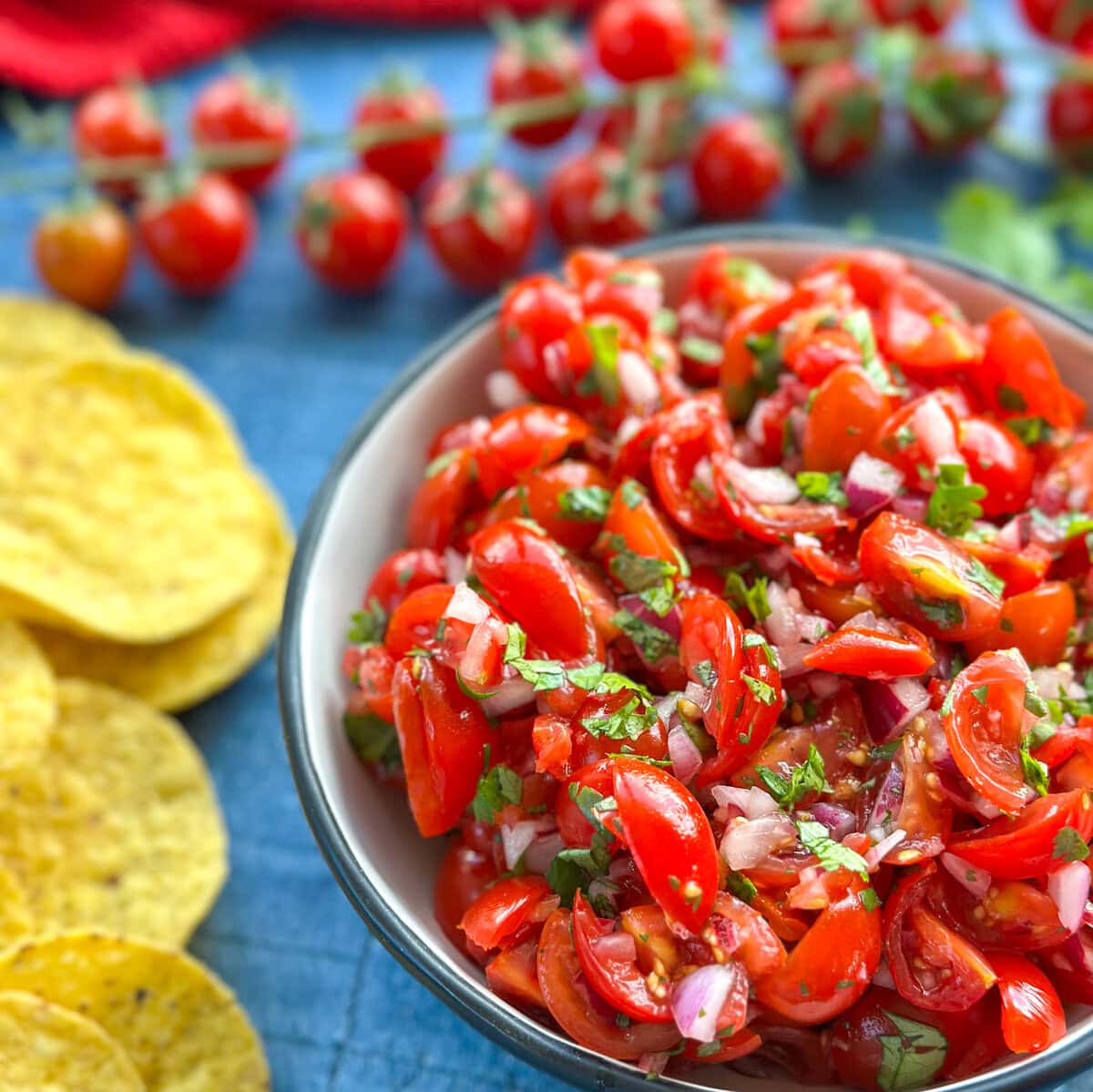 Chunky Cherry Tomato Salsa in a bowl with corn chips