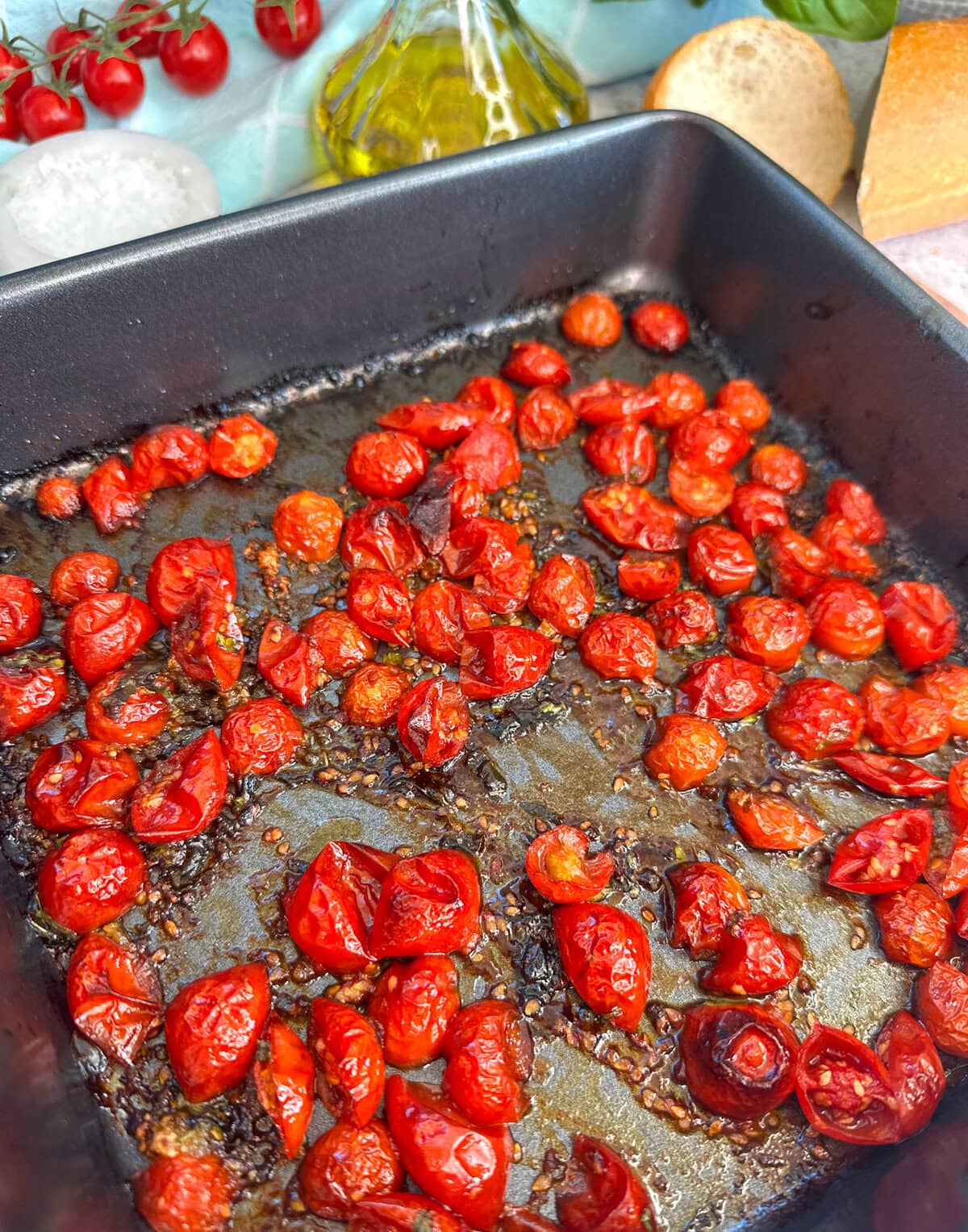 roasted and charred cherry tomatoes in a roasting dish