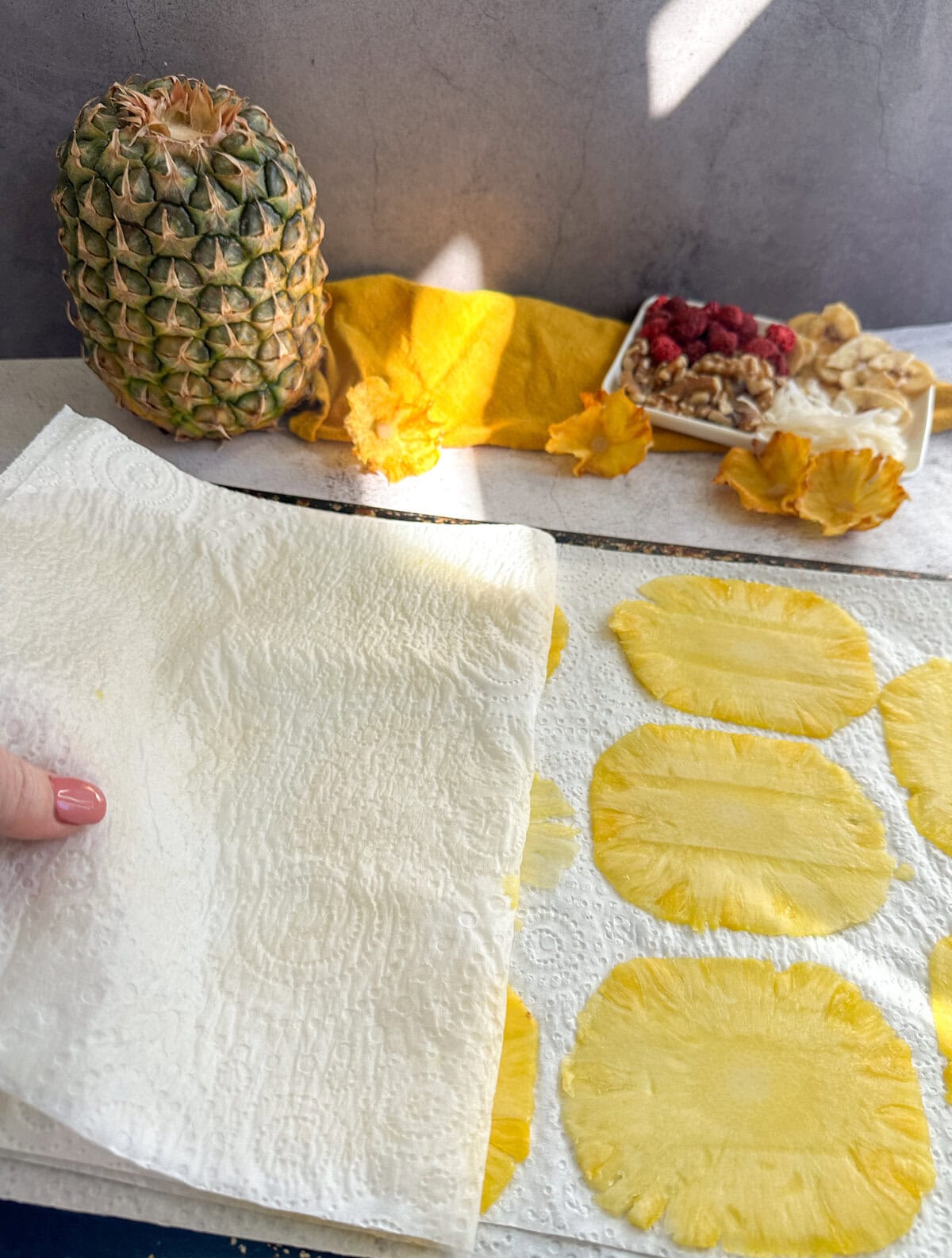 Carefully peeling back the paper towels between drying slices. 