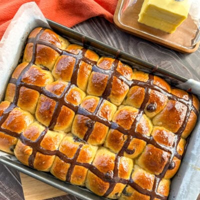 fresh from the oven orange and chocolate hot cross buns with a orange glaze