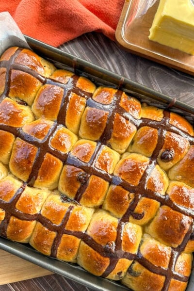 fresh from the oven orange and chocolate hot cross buns with a orange glaze