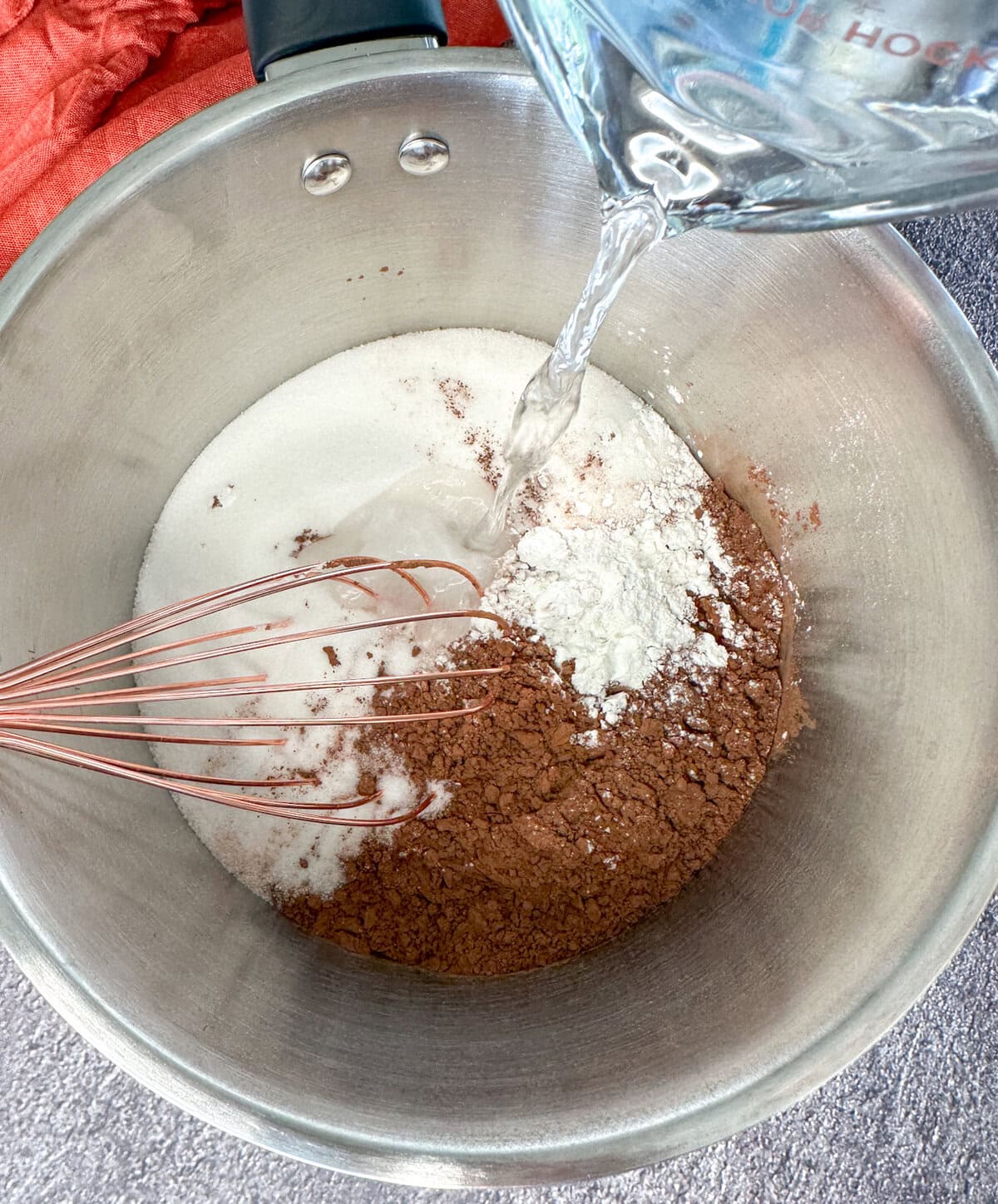 adding water to chocolate syrup ingredients for lamingtons