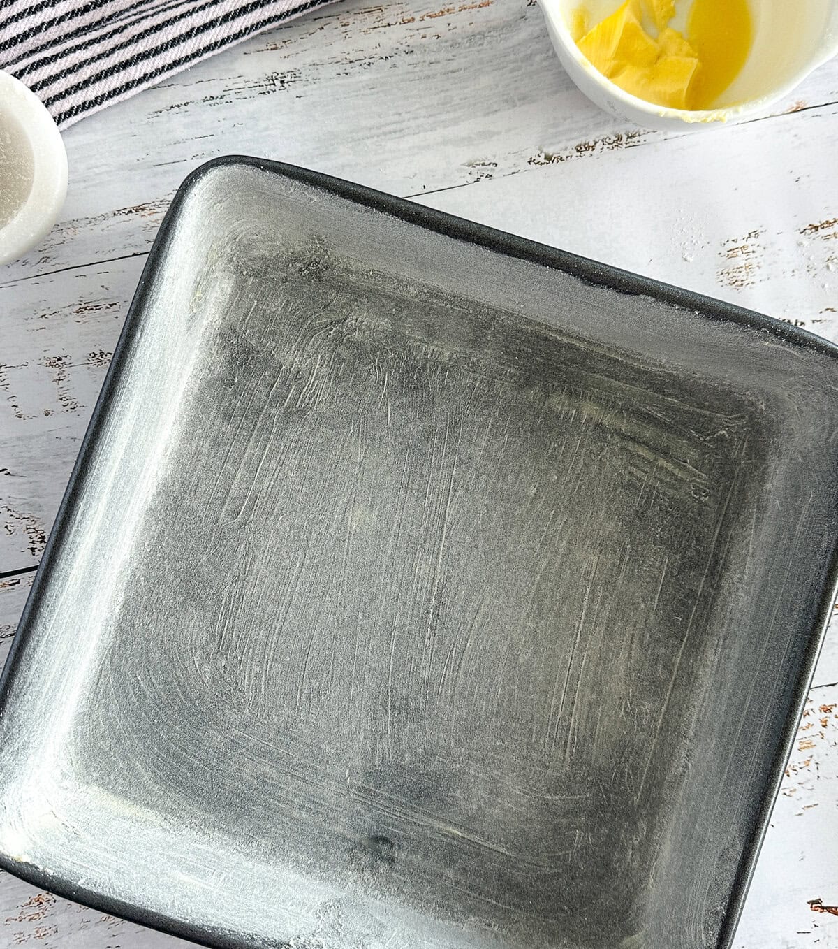 prepared baking tin with butter and flour