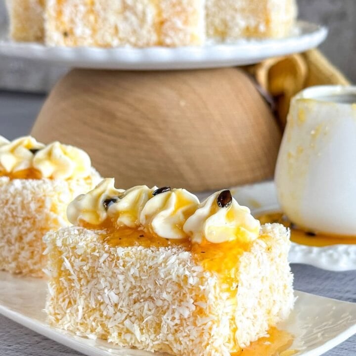 passionfruit Lamington with mascarpone cream piped on the top and a drizzle of passionfruit pulp