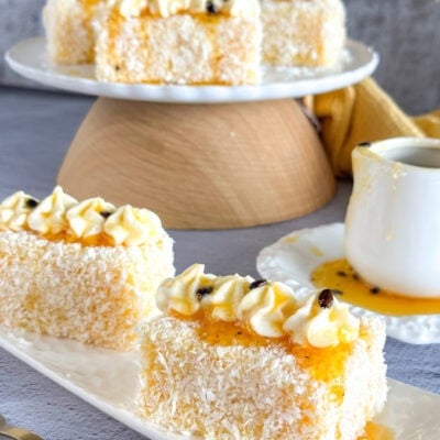 Servings of passionfruit lamingtons with piped mascarpone cream.