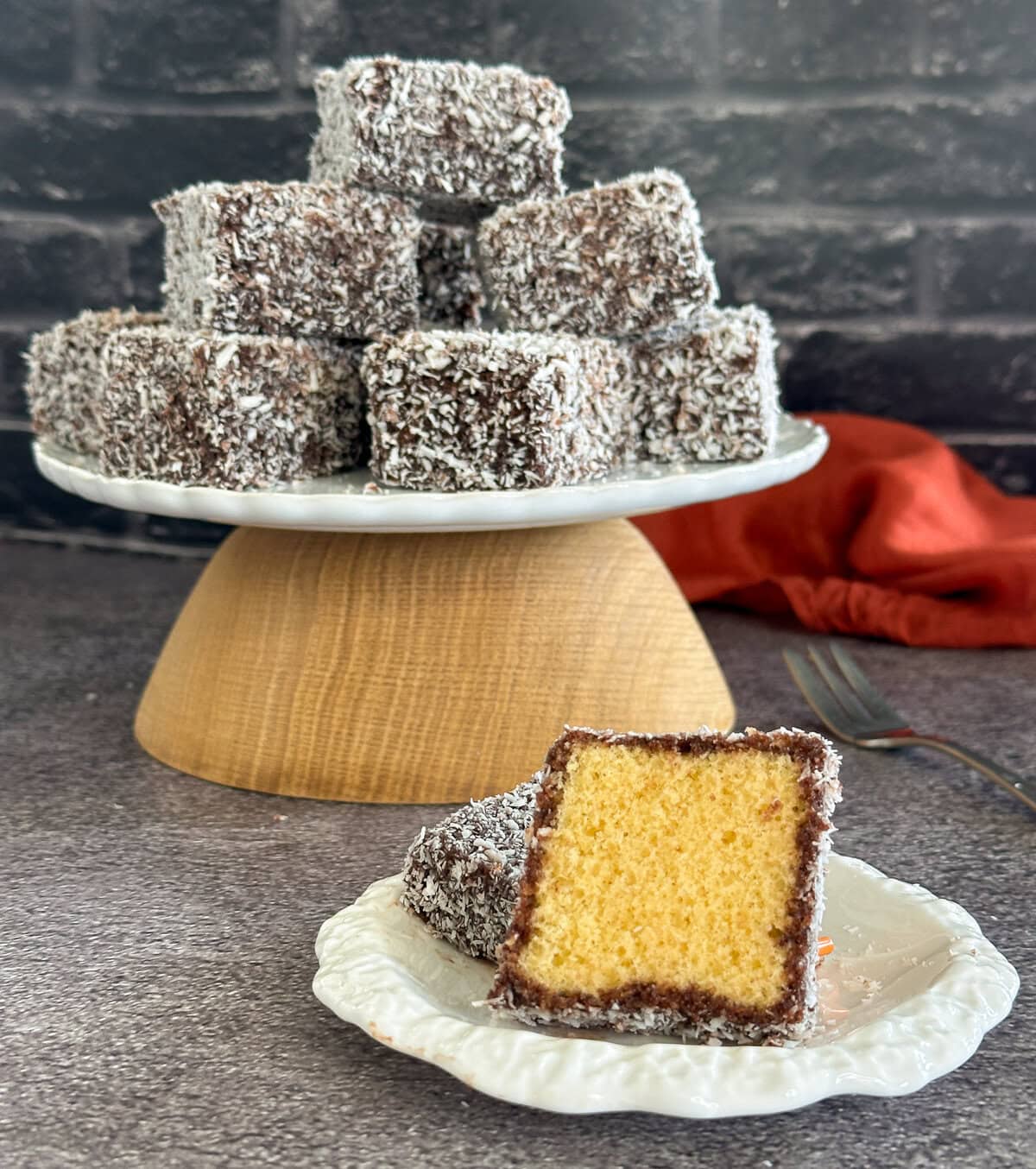 Chocolate lamingtons showing fresh light sponge inside.